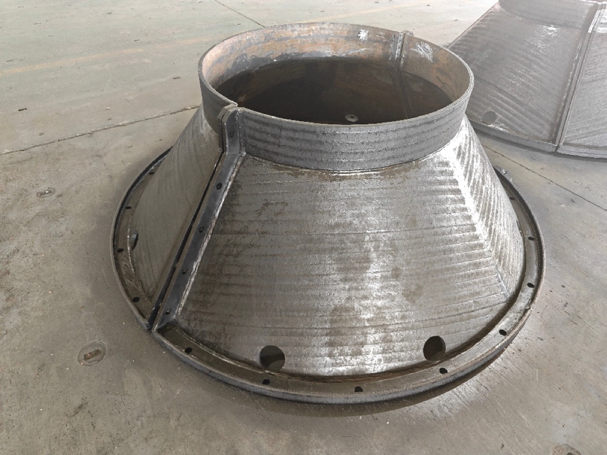 Cone-shaped hardfaced liner assembly for a chute or hopper